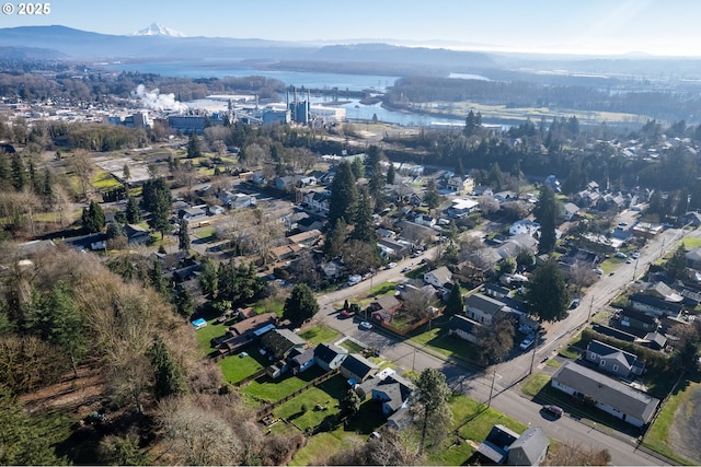 aerial view featuring a water and mountain view