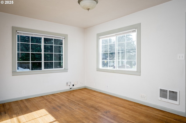 unfurnished room featuring wood-type flooring