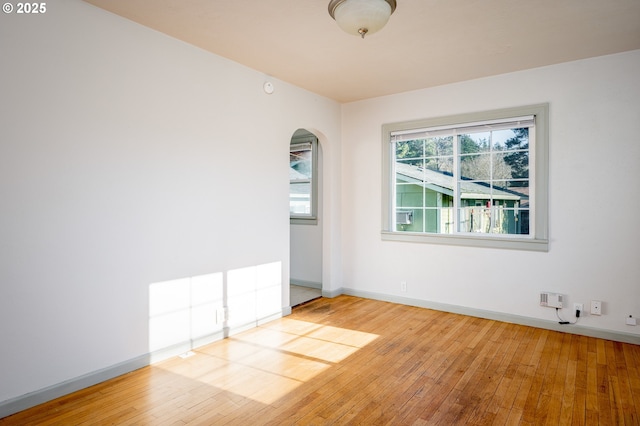 spare room featuring light hardwood / wood-style floors