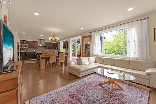 8070 SW 195th Ave, Beaverton, OR 97007 - living room with dark wood-style floors, a chandelier, and recessed lighting