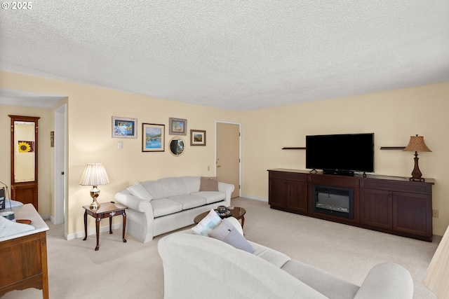 living area featuring light carpet, a textured ceiling, and baseboards