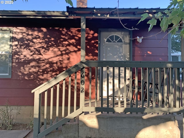 entrance to property featuring a chimney