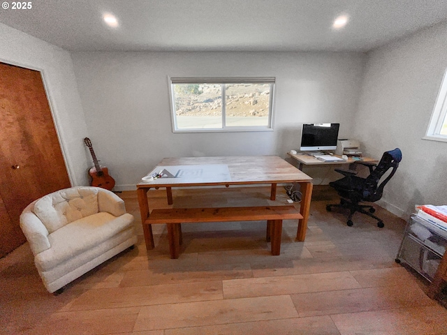 office area with baseboards, light wood-style flooring, and recessed lighting