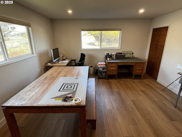 office space with light wood finished floors, baseboards, and recessed lighting
