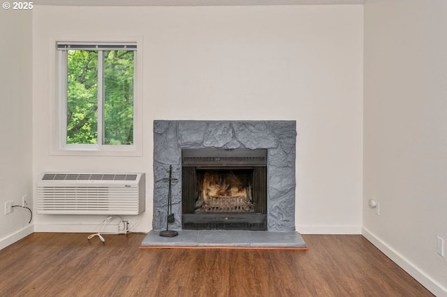 12062 SW Conestoga Dr, Beaverton, OR 97008 - detailed view of an AC wall unit, wood finished floors, and baseboards