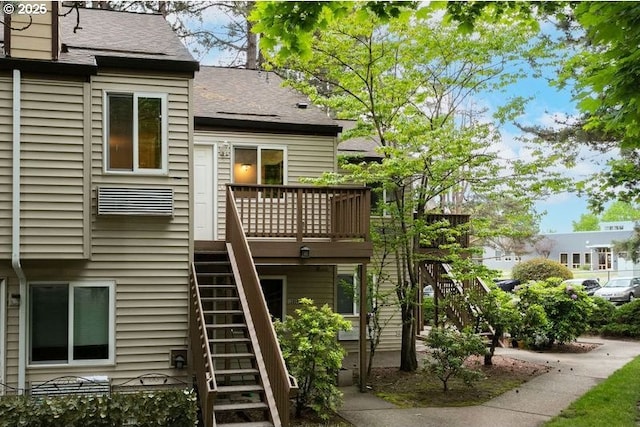 12062 SW Conestoga Dr, Beaverton, OR 97008 - back of house with stairway, a wooden deck, and roof with shingles