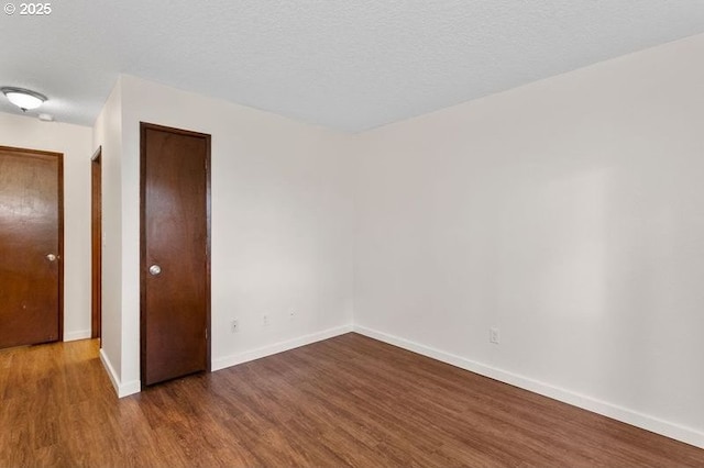 12062 SW Conestoga Dr, Beaverton, OR 97008 - empty room featuring wood finished floors and baseboards