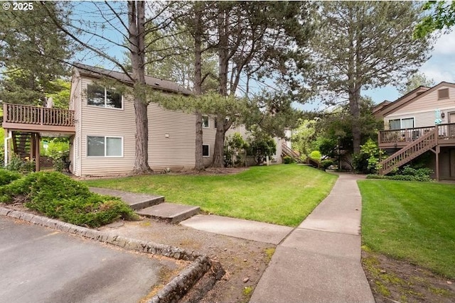 12062 SW Conestoga Dr, Beaverton, OR 97008 - view of grassy yard featuring stairway and a deck