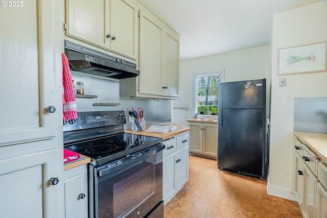 kitchen with under cabinet range hood, light floors, black appliances, and light countertops