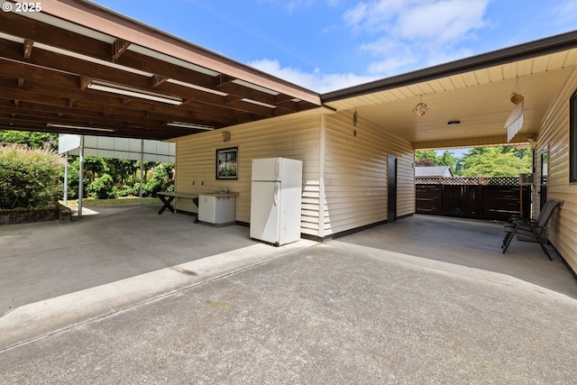 107 NW 10th Ave, Canby, OR 97013 - view of car parking featuring a carport and concrete driveway