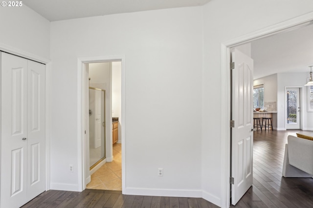 interior space with dark hardwood / wood-style flooring and a closet