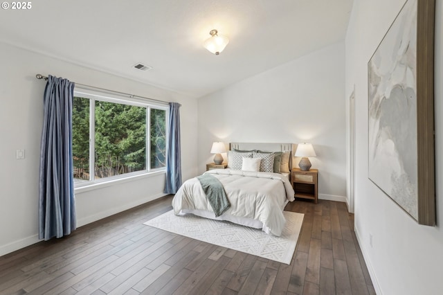 bedroom featuring dark hardwood / wood-style flooring