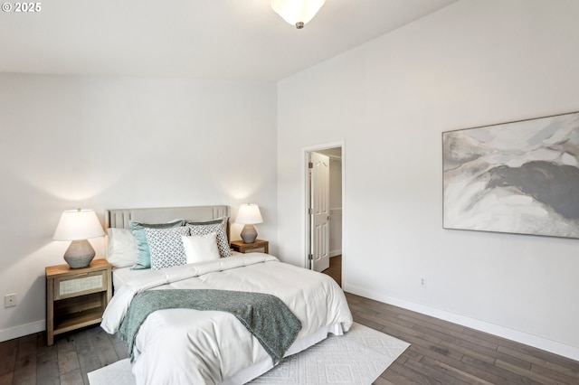 bedroom with dark hardwood / wood-style flooring