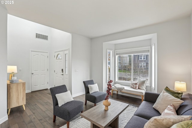 living room with dark hardwood / wood-style flooring