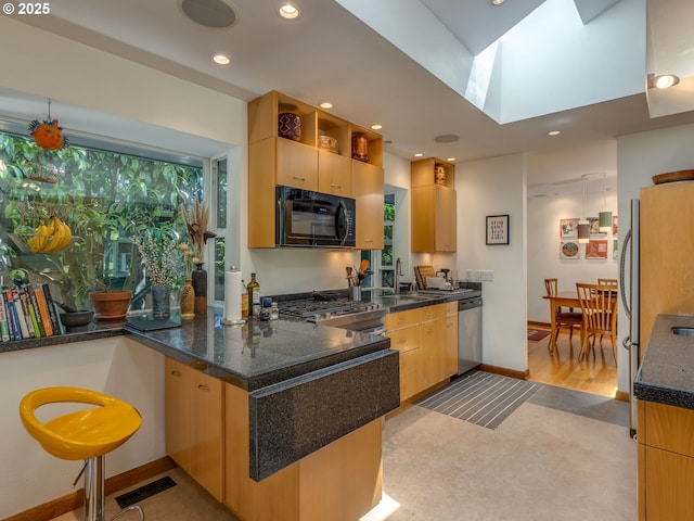 6310 NE 31st Ave Unit A, And B, Portland, OR 97211 - kitchen featuring black microwave, stainless steel dishwasher, recessed lighting, a sink, and a peninsula