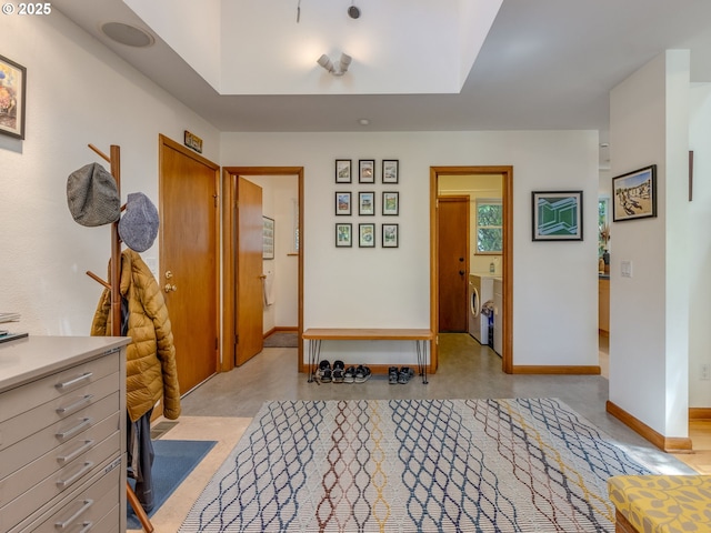 6310 NE 31st Ave Unit A, And B, Portland, OR 97211 - entrance foyer with baseboards and washing machine and dryer