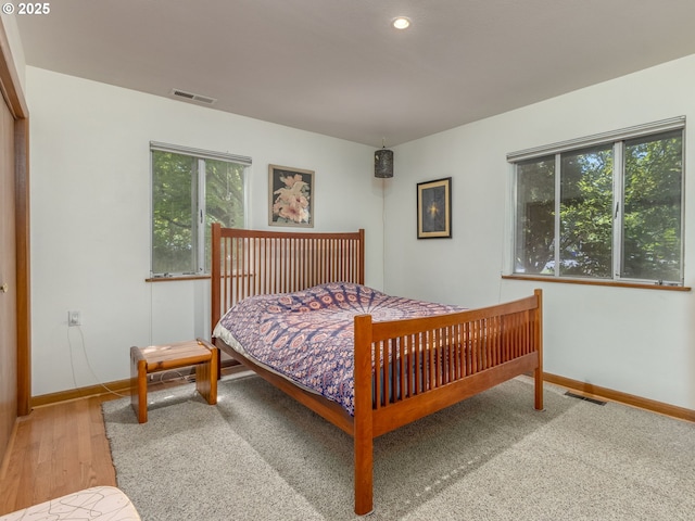 6310 NE 31st Ave Unit A, And B, Portland, OR 97211 - bedroom with multiple windows, baseboards, recessed lighting, and wood finished floors