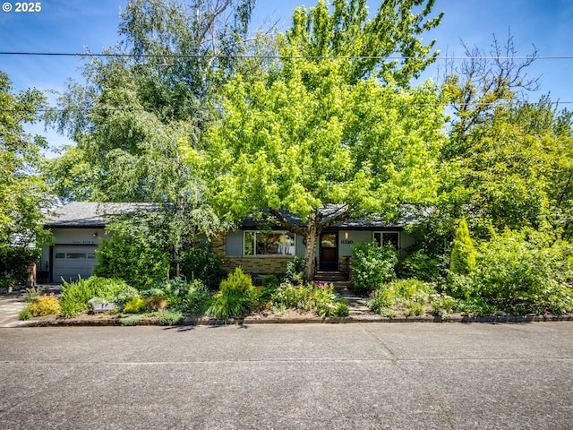 6310 NE 31st Ave Unit A, And B, Portland, OR 97211 - view of property hidden behind natural elements with a garage