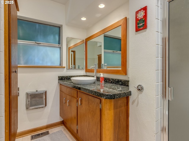 6310 NE 31st Ave Unit A, And B, Portland, OR 97211 - bathroom featuring heating unit, vanity, and recessed lighting