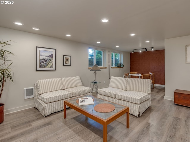 6310 NE 31st Ave Unit A, And B, Portland, OR 97211 - living area featuring baseboards, track lighting, light wood-style flooring, and recessed lighting
