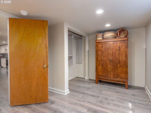 6310 NE 31st Ave Unit A, And B, Portland, OR 97211 - bedroom featuring light wood-type flooring, baseboards, a closet, and recessed lighting
