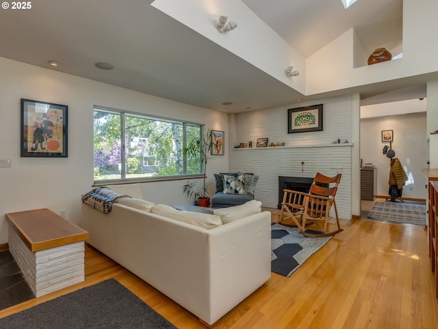6310 NE 31st Ave Unit A, And B, Portland, OR 97211 - living area with light wood-style floors, a fireplace, recessed lighting, and vaulted ceiling