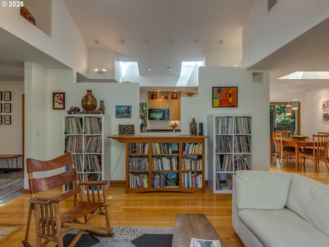 6310 NE 31st Ave Unit A, And B, Portland, OR 97211 - living area featuring a skylight, wood finished floors, and recessed lighting