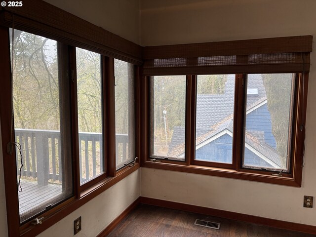 unfurnished sunroom featuring a healthy amount of sunlight