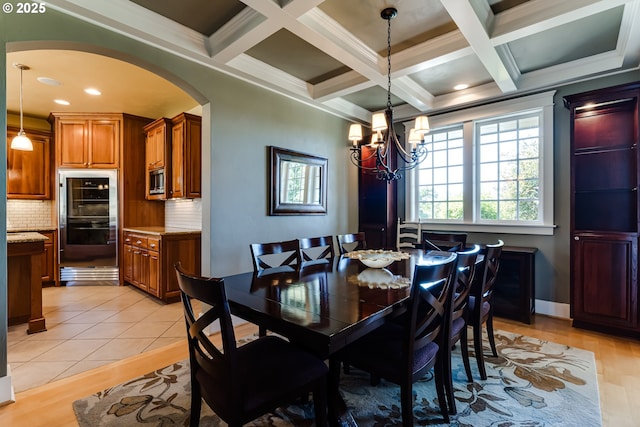 83500 Enterprise Rd, Creswell, OR 97426 - dining space with light wood-type flooring, a chandelier, arched walkways, beam ceiling, and coffered ceiling