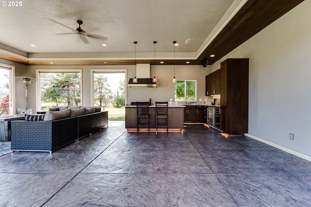 83500 Enterprise Rd, Creswell, OR 97426 - living area with ceiling fan, a tray ceiling, and beverage cooler