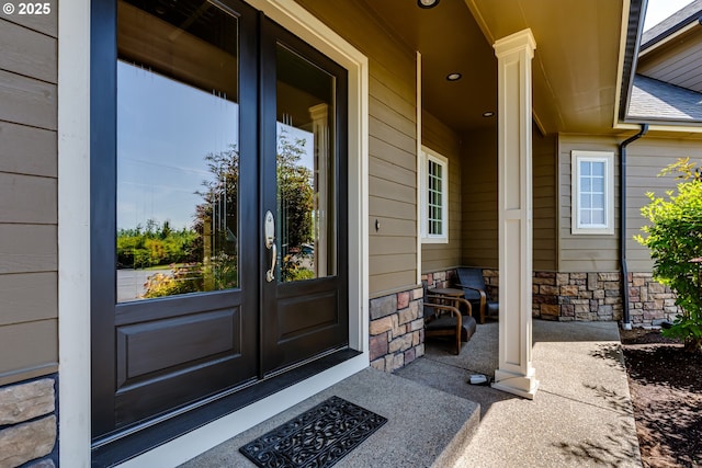 83500 Enterprise Rd, Creswell, OR 97426 - entrance to property with french doors, stone siding, and a porch