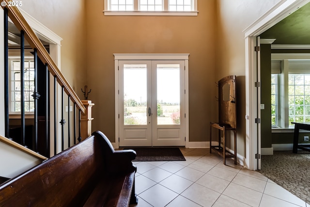 83500 Enterprise Rd, Creswell, OR 97426 - entryway with light tile patterned floors, a towering ceiling, french doors, and stairs
