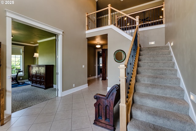 83500 Enterprise Rd, Creswell, OR 97426 - stairs with tile patterned floors, crown molding, a high ceiling, and carpet flooring