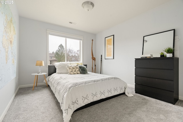 bedroom with carpet flooring, visible vents, and baseboards