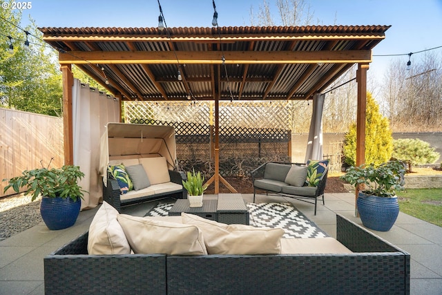 view of patio / terrace with fence and an outdoor living space