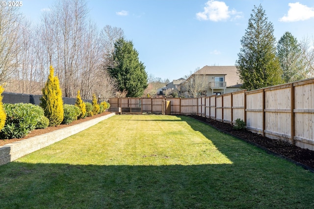 view of yard featuring a fenced backyard