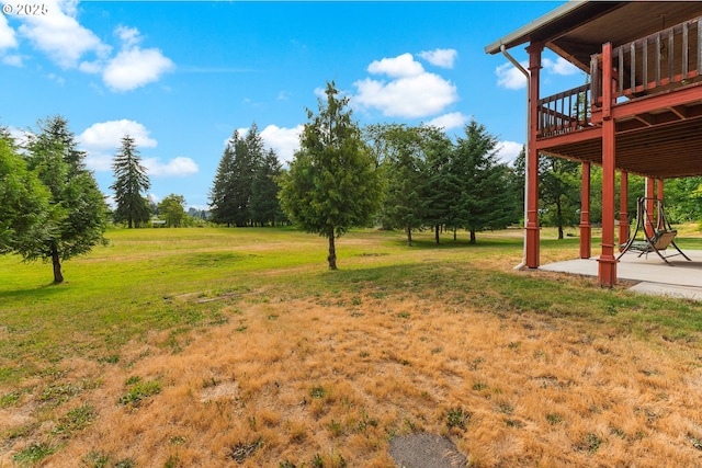 4311 NW 419th St, Woodland, WA 98674 - view of grassy yard with a deck and a patio area