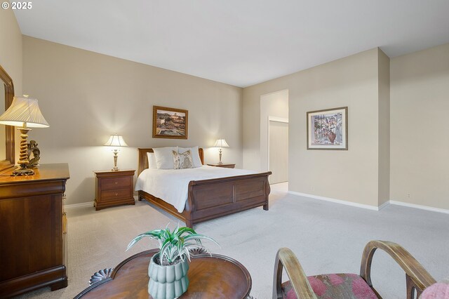 bedroom featuring light colored carpet