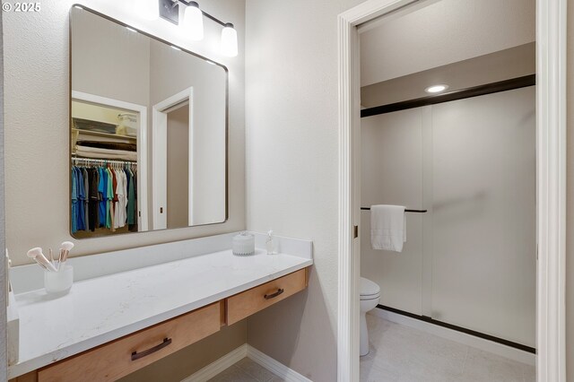 bathroom with vanity and a towering ceiling