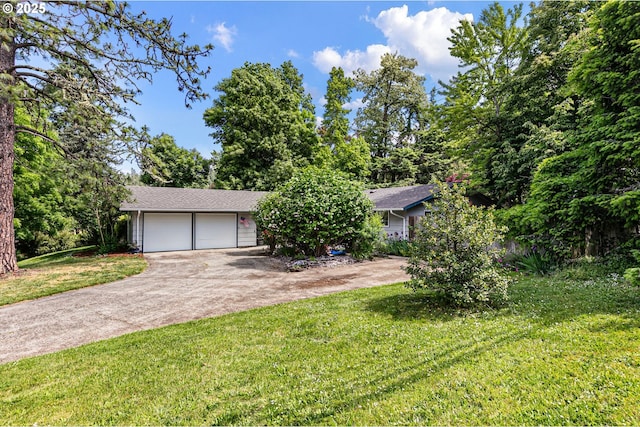18 E 47th Ave, Eugene, OR 97405 - obstructed view of property with driveway, a garage, and a front lawn
