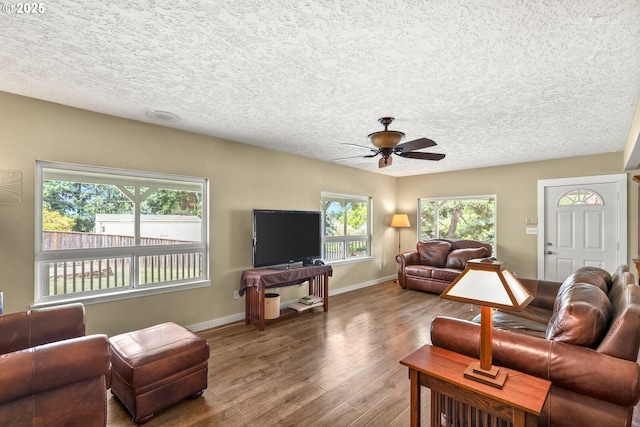 7375 SW 185th Ave, Beaverton, OR 97007 - living area featuring a ceiling fan, wood finished floors, and a textured ceiling