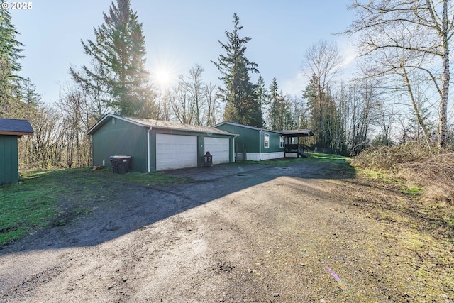 exterior space with dirt driveway