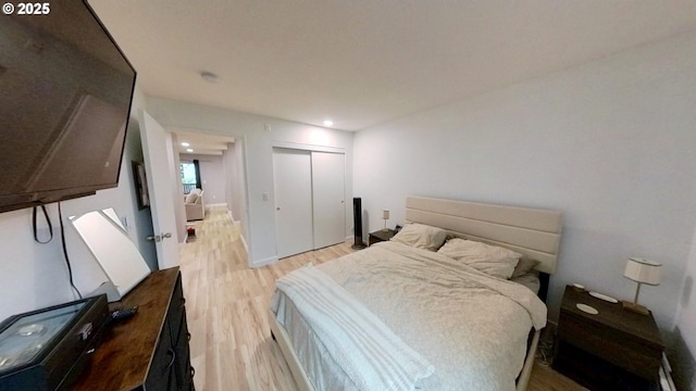 10690 SW Davies Rd Unit 53, Beaverton, OR 97008 - bedroom with light wood finished floors, a closet, and recessed lighting