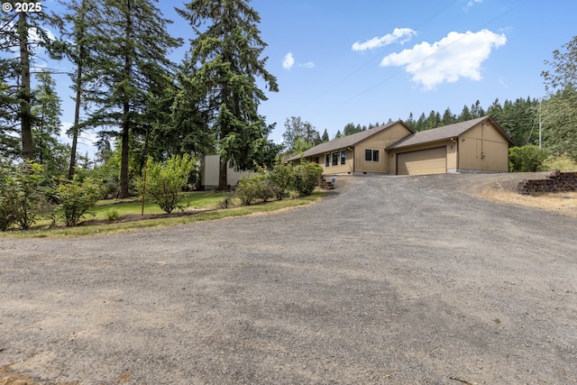 5580 Franklin Blvd, Eugene, OR 97403 - view of front of property with dirt driveway and an attached garage