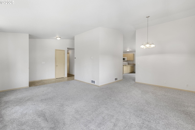 5580 Franklin Blvd, Eugene, OR 97403 - unfurnished living room with a chandelier and light carpet