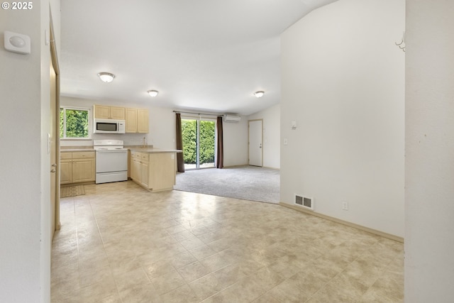 5580 Franklin Blvd, Eugene, OR 97403 - kitchen featuring white appliances, light brown cabinets, a wall mounted air conditioner, open floor plan, and light countertops
