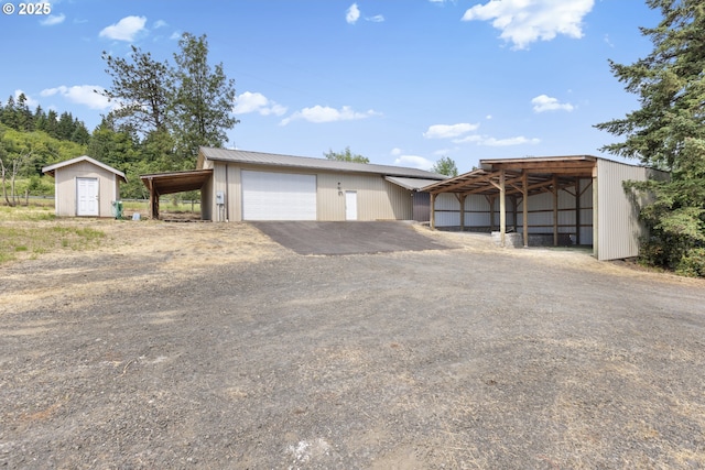 5580 Franklin Blvd, Eugene, OR 97403 - garage with dirt driveway and a detached garage
