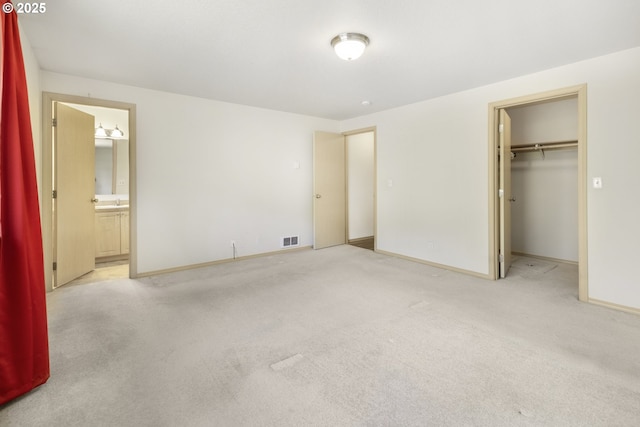 5580 Franklin Blvd, Eugene, OR 97403 - unfurnished bedroom with carpet flooring, a walk in closet, ensuite bath, and a closet