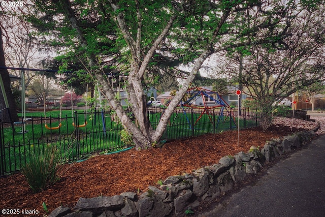 view of jungle gym with fence