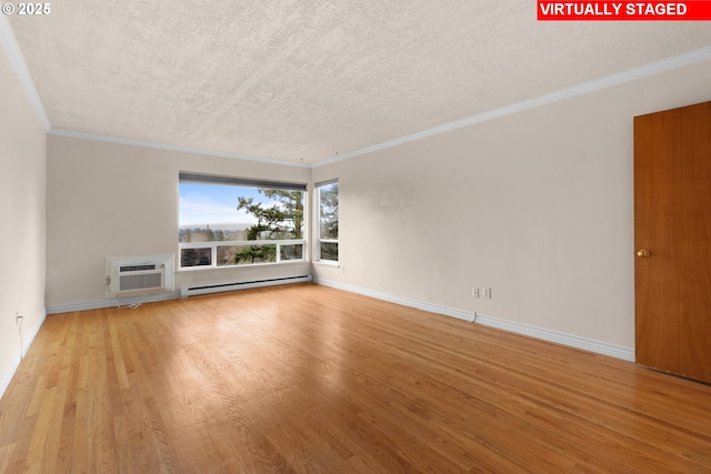 unfurnished living room featuring light wood-type flooring, a textured ceiling, a wall unit AC, baseboard heating, and crown molding